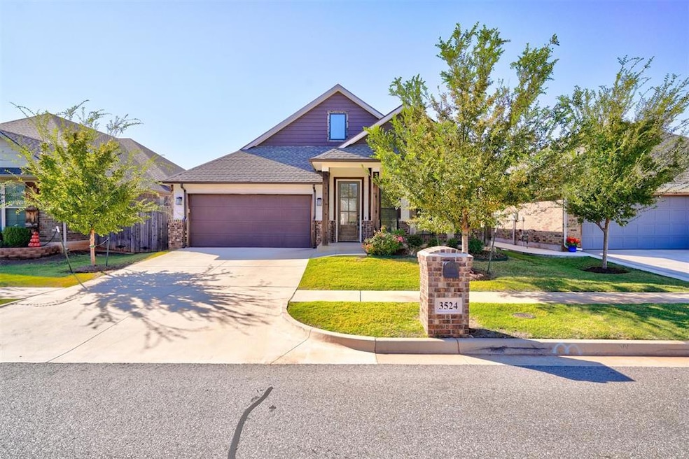View of front of property featuring a garage and a