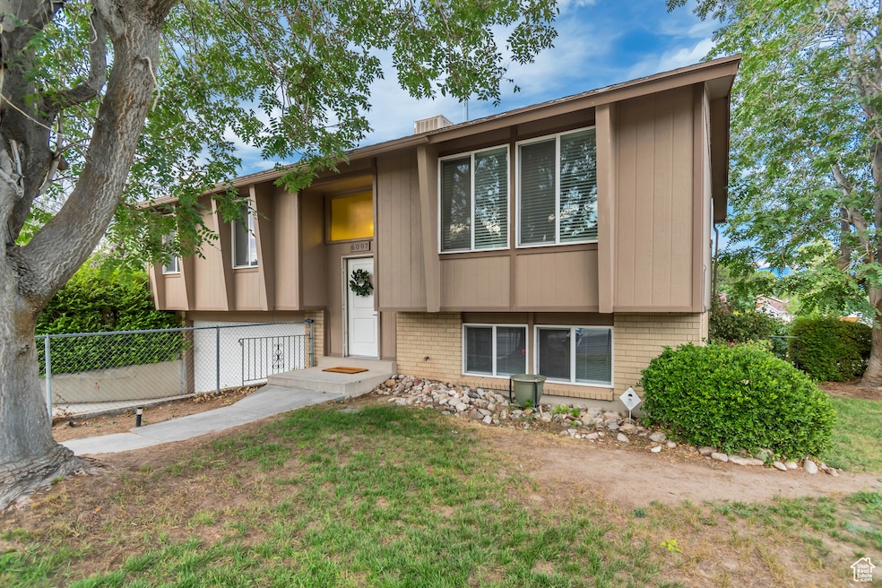 Split foyer home with brick siding