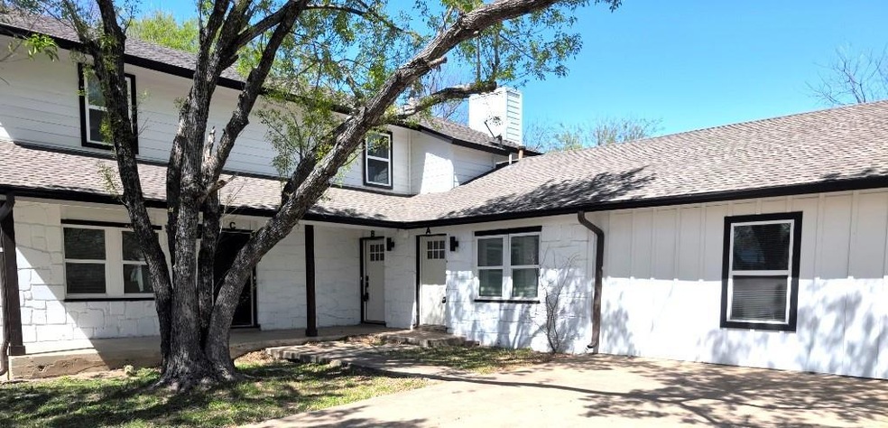 View of front of home with roof with shingles and