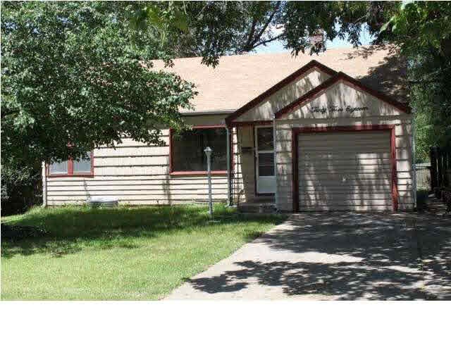 Front of Home is surrounded by many trees.