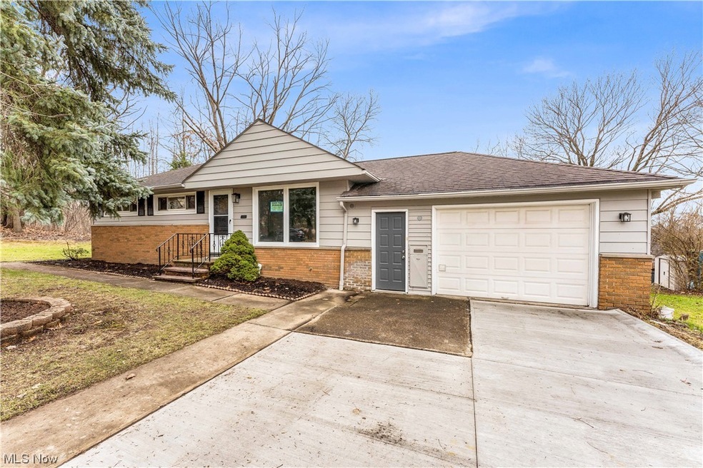 View of front facade featuring a garage