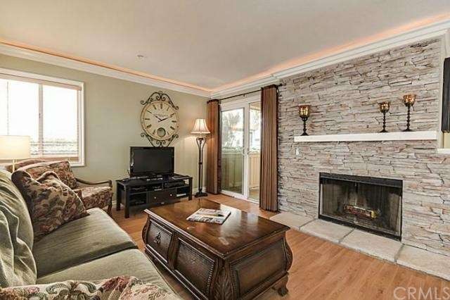 Living Room with Wood Laminate Floors Patio Access