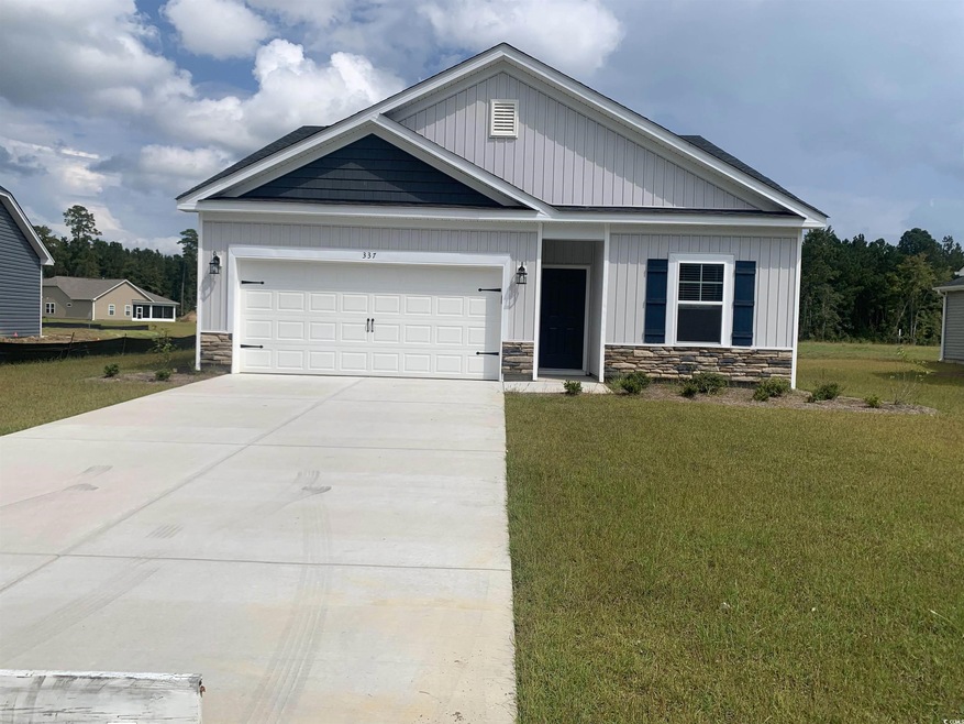 View of front facade featuring a front yard and a 