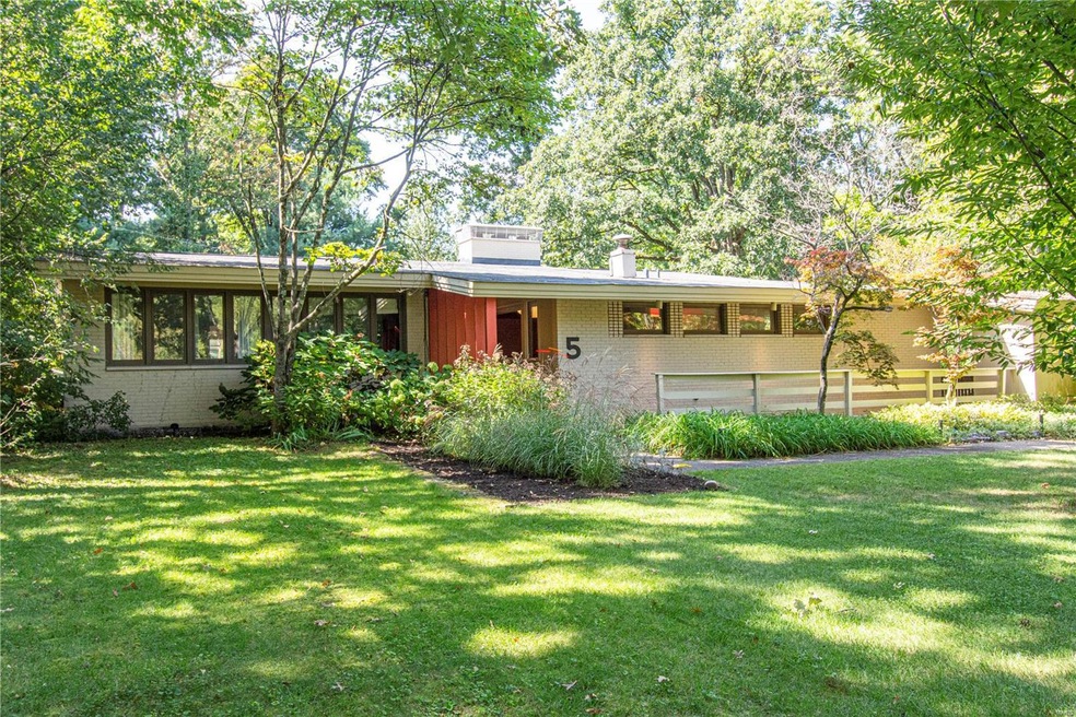 Welcome to 5 Cedar Crest in Ladue - a sprawling mi