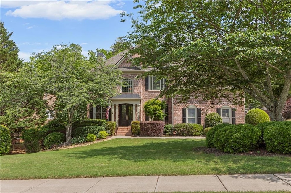 Stunning curb appeal with manicured landscaping, updated exterior lighting, and a welcoming front entrance—this home makes a great first impression.