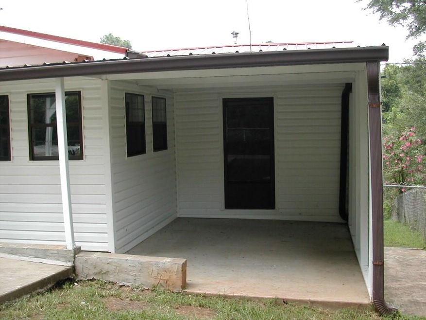 Front covered patio off additional large bedroom or den