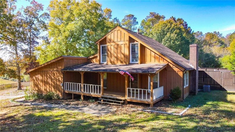 View of front of property featuring a porch, a fro