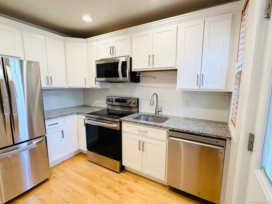 61 Mencel Cir unit 61, Bridgeport, CT 06610 - photo 1