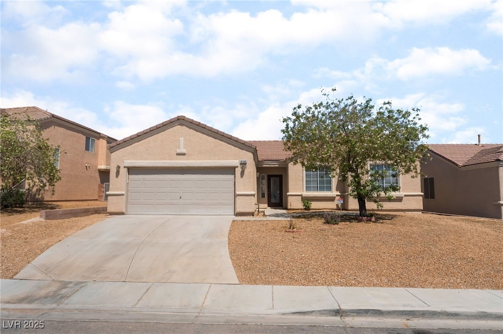 Single story home featuring an attached garage, a