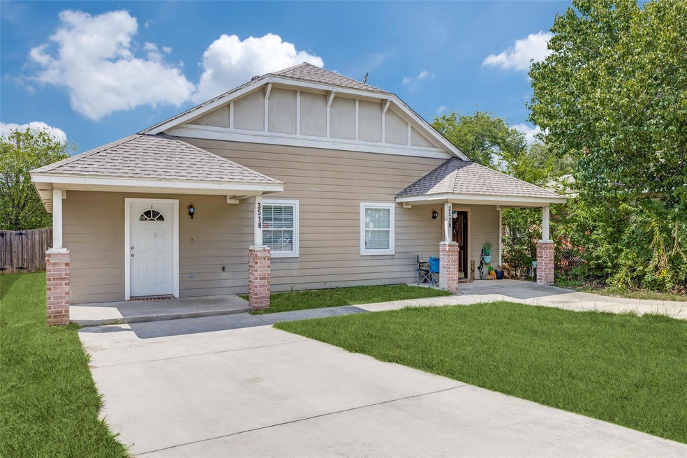 View of front of home with a front lawn and covere