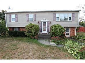 Exterior Front. vinyl siding and Brick