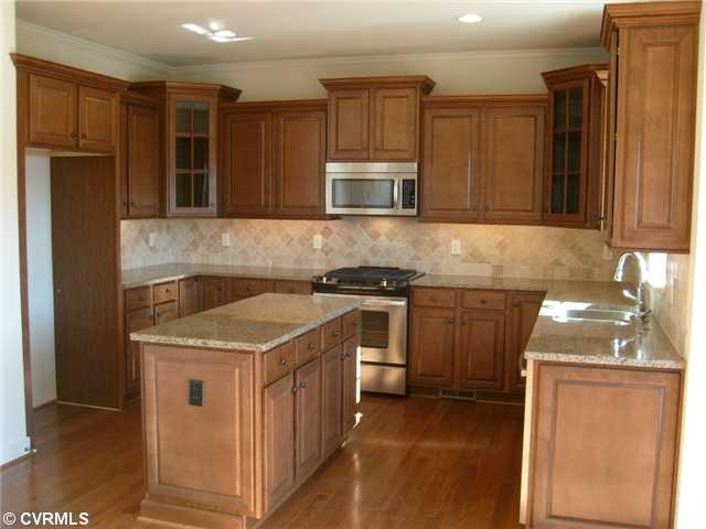 Kitchen - gourmet kitchen with designer back splas