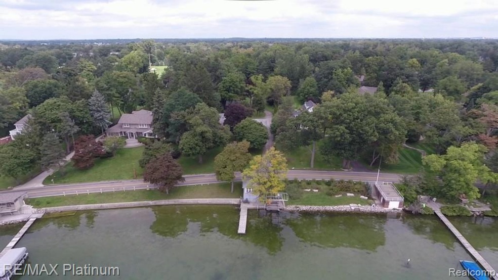 Mature trees shade this Pine Lakefront property