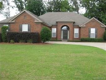 Front of home with professional landscaping and co
