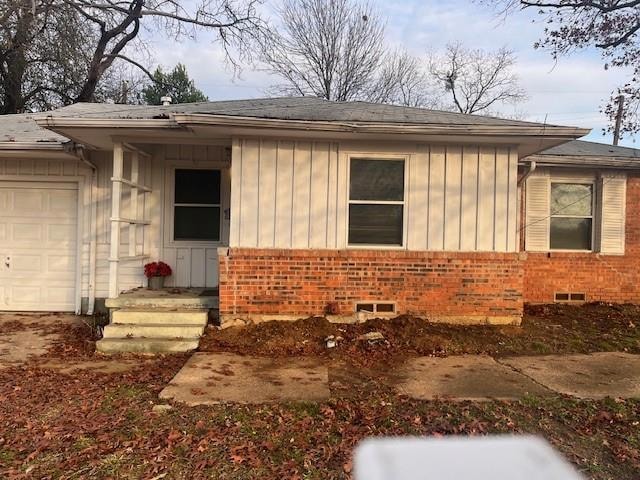 View of front of property with a garage