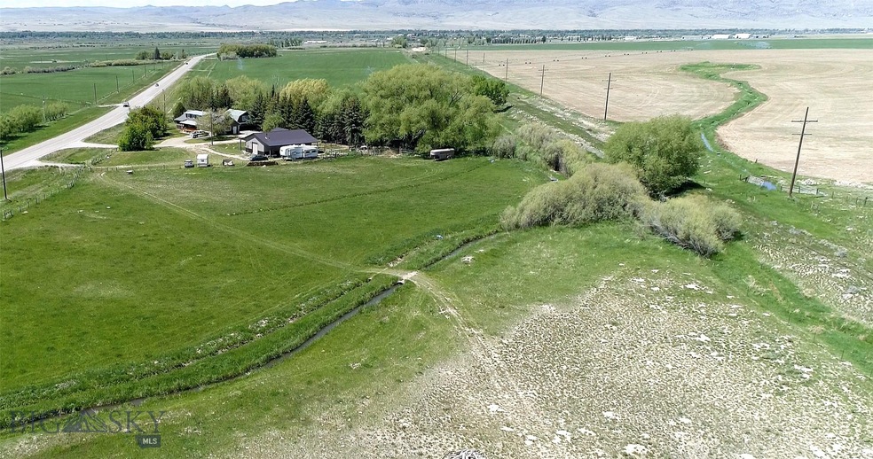 Meadow with improvements in background.