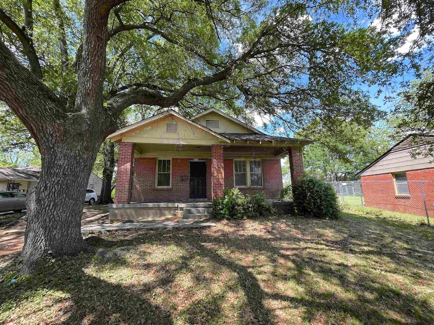 Bungalow-style home featuring a porch, brick sidin