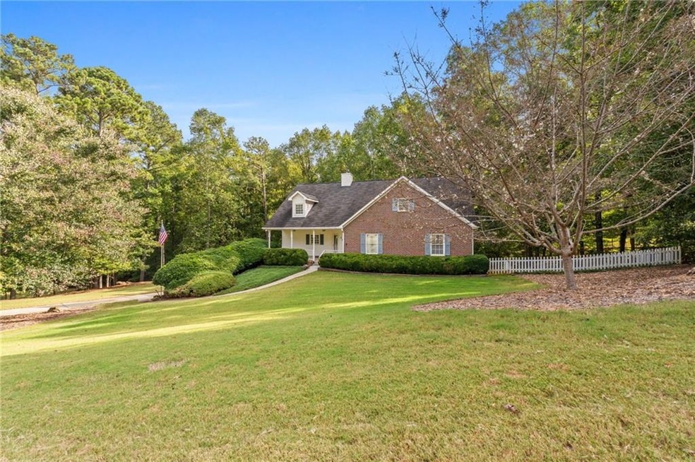 Cape cod-style house with a front lawn