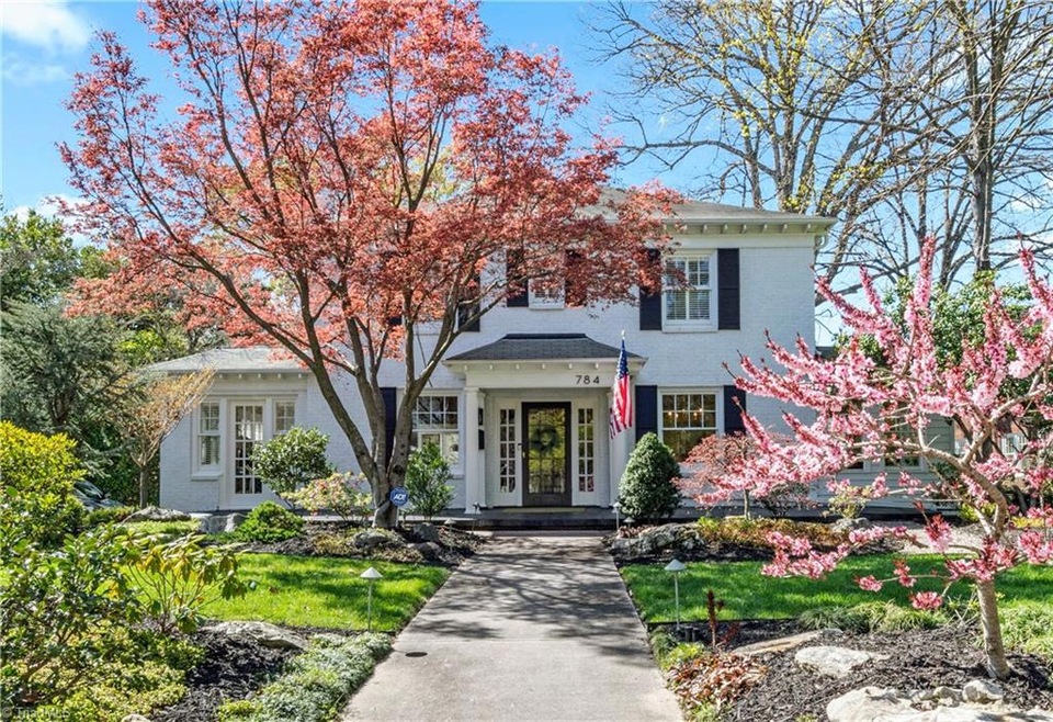 Exquisite front gardens designed to have blooms for every season.