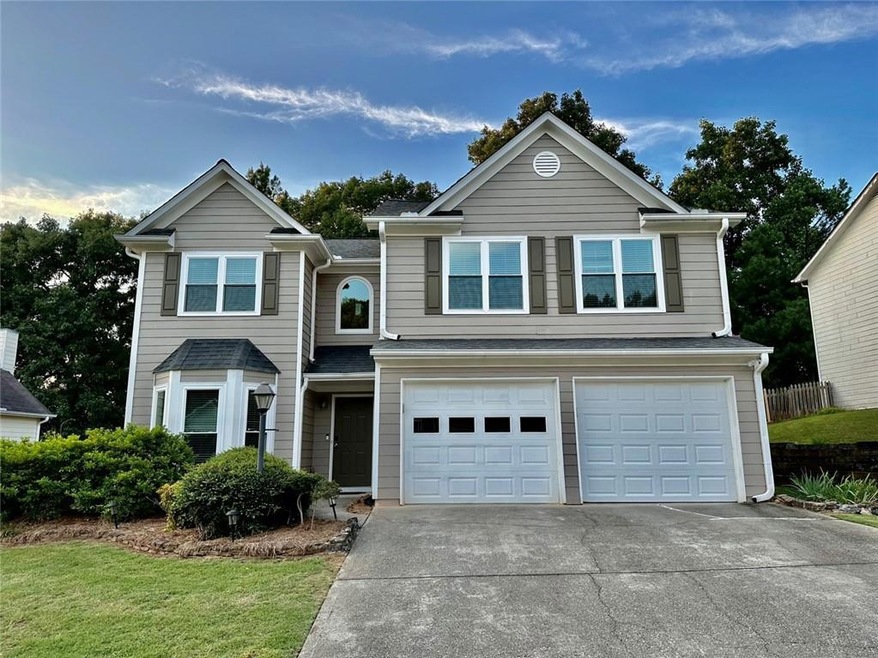 View of front of property featuring a garage and a