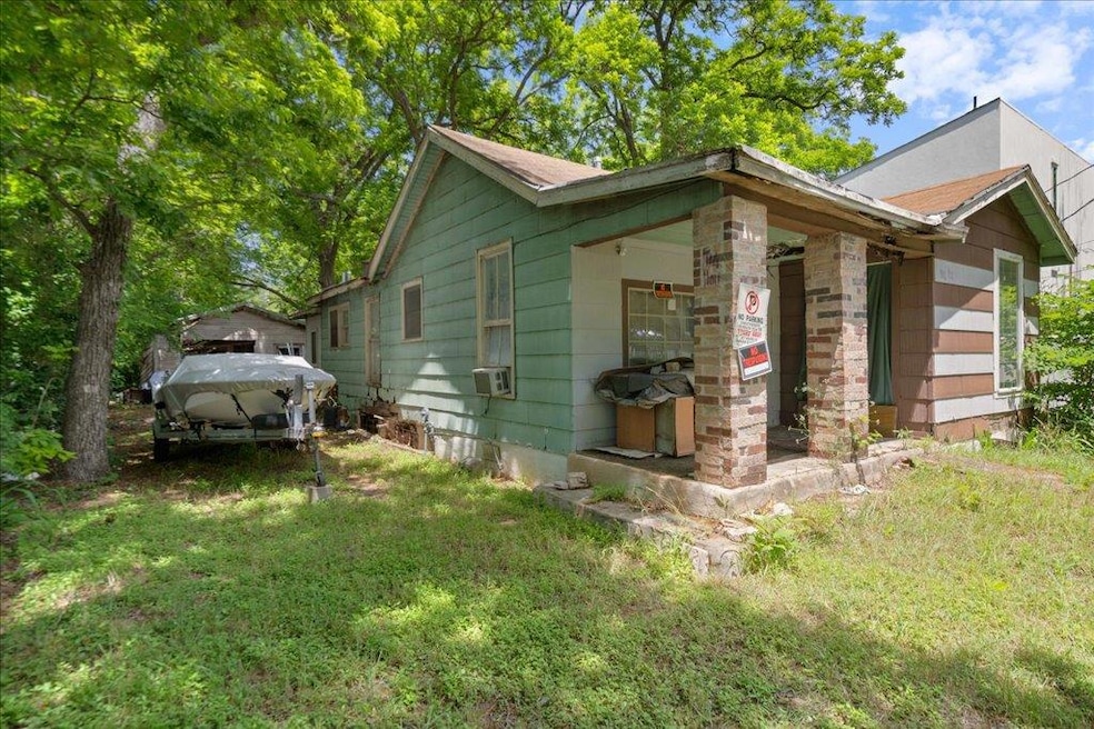 View of side of home with cooling unit