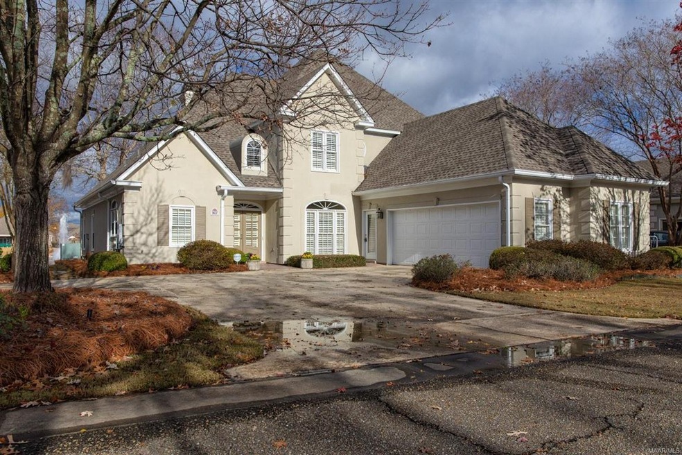 Front entrance with lots of landscaping.