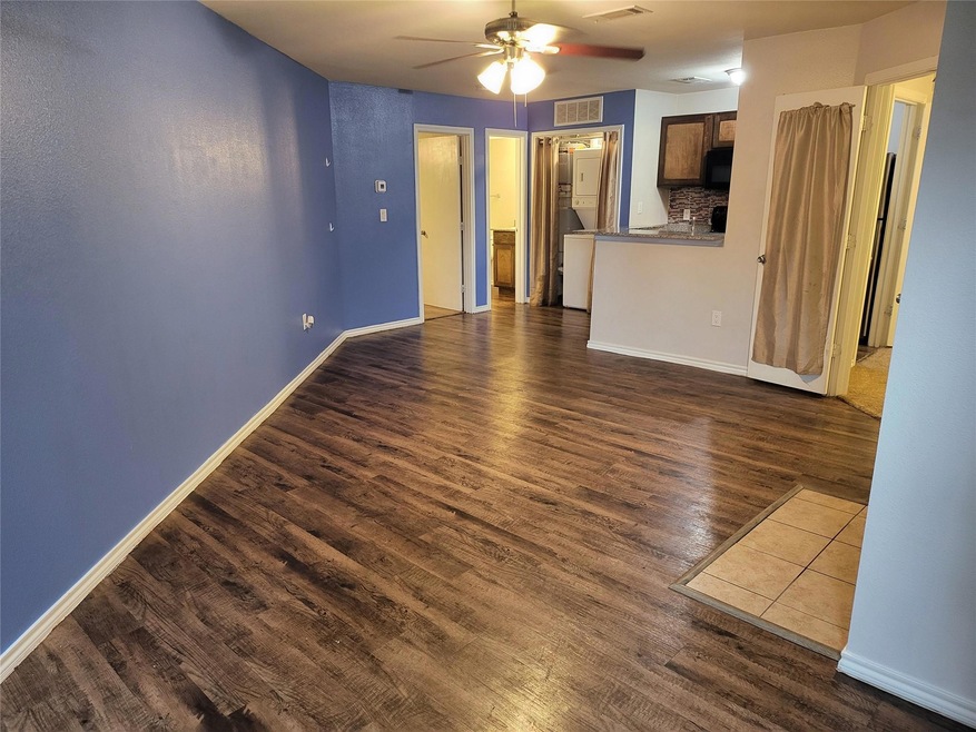 Spare room featuring dark hardwood / wood-style fl