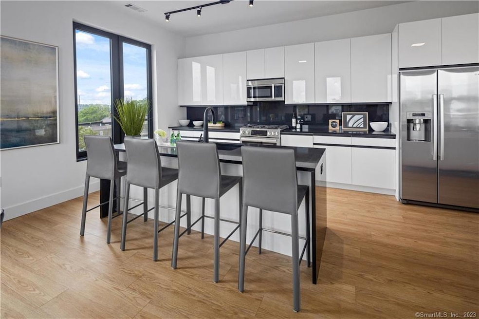 Photos depict model unit. All finishes and ceiling