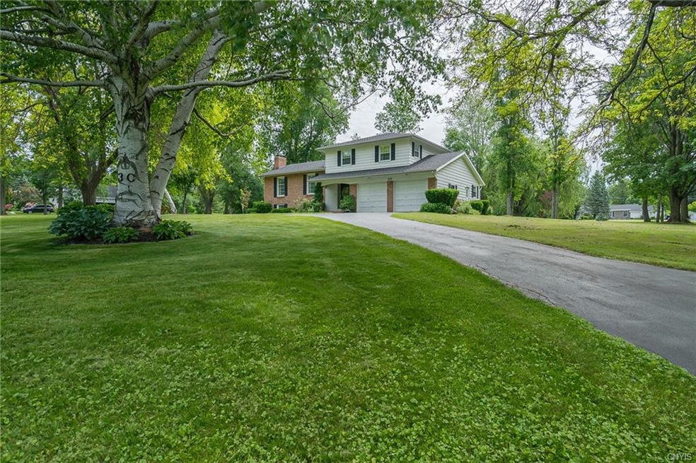 FRONT EXTERIOR INCLUDING SEMI CIRCLE DRIVEWAY ON 1