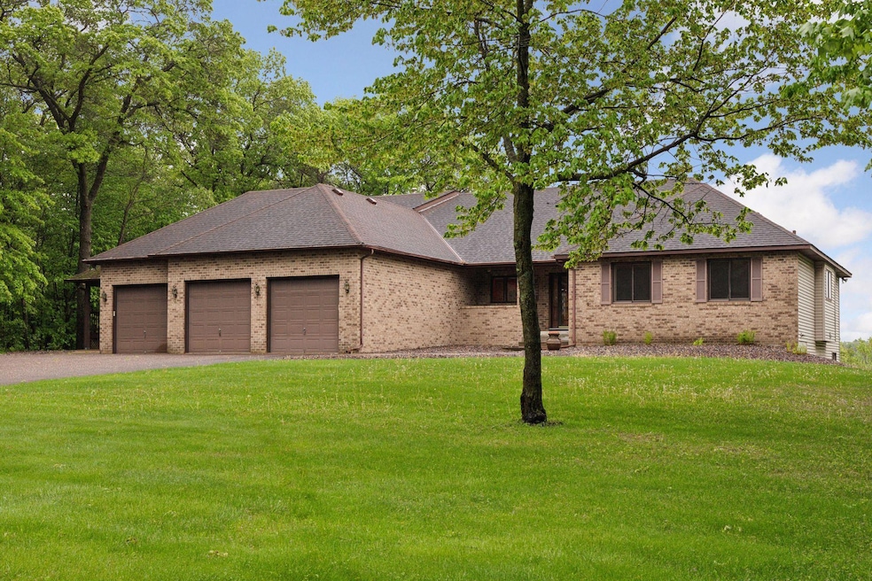 This one of a kind home sits on an idyllic 3.25 acres on the border of Ham Lake and Andover.