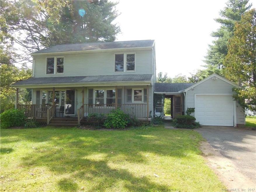 Front of house with breezeway and 1 car garage wit