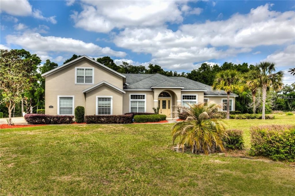 Exterior Front with Mature Landscaping
