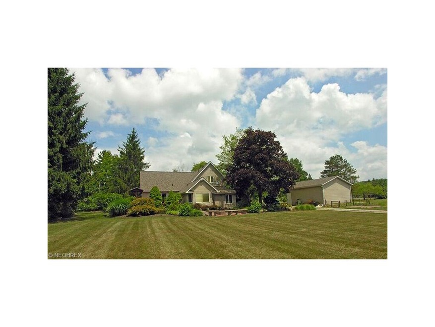 Lush landscaping surrounds this house with many pe