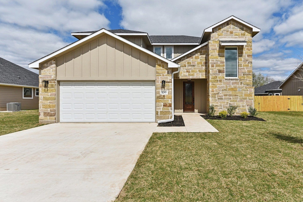 View of front of house featuring fence, concrete 