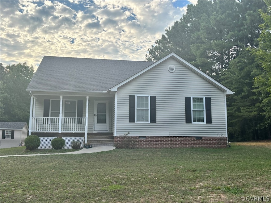 View of front of home with a porch and a front yar