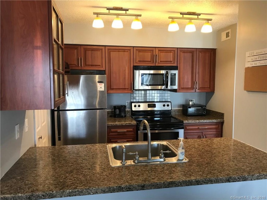 Beautiful bright kitchen with granite counter tops