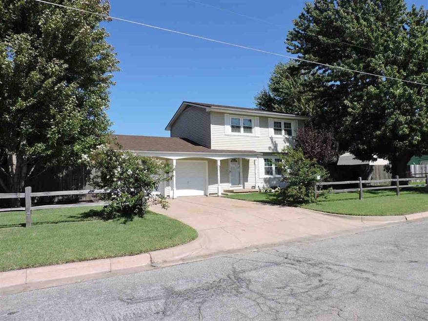 2 story Home on corner lot. Wood privacy fence aro