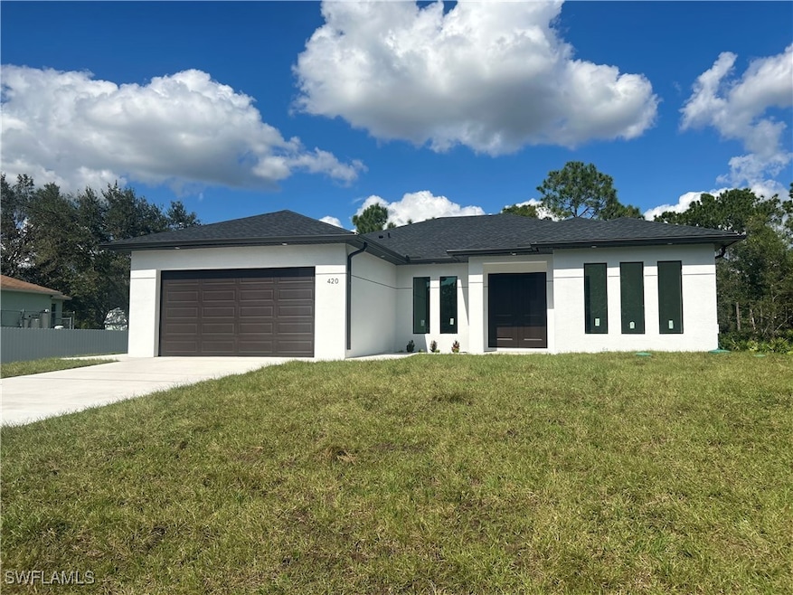 View of front of home featuring a garage and a fro
