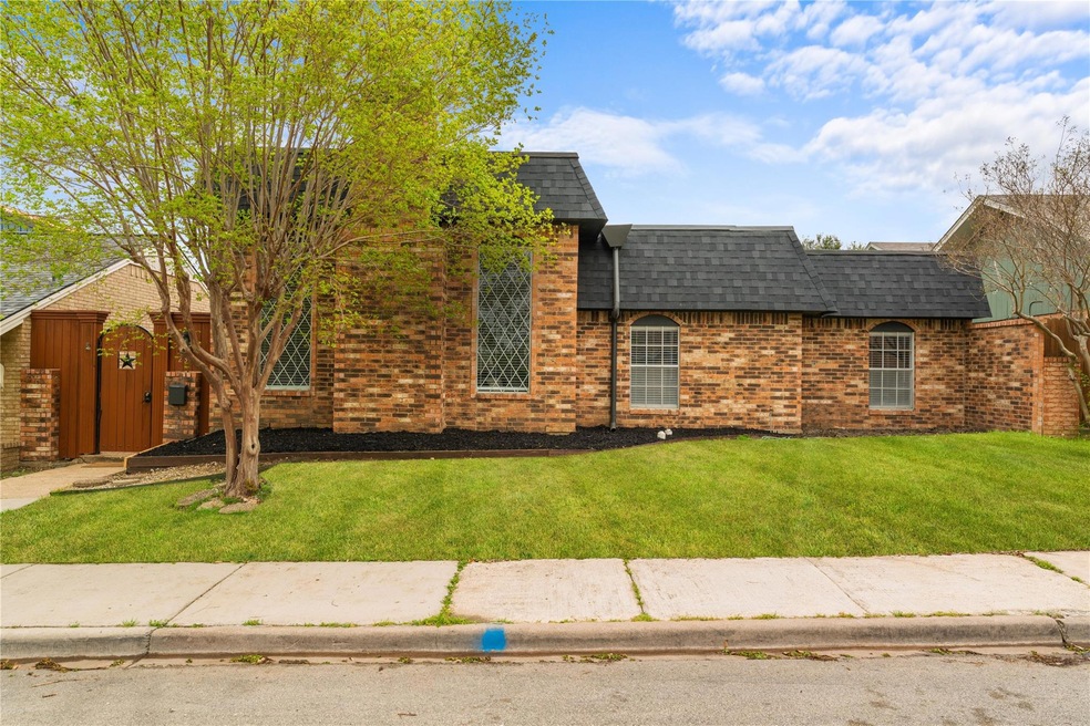 View of front of property featuring mansard roof, 
