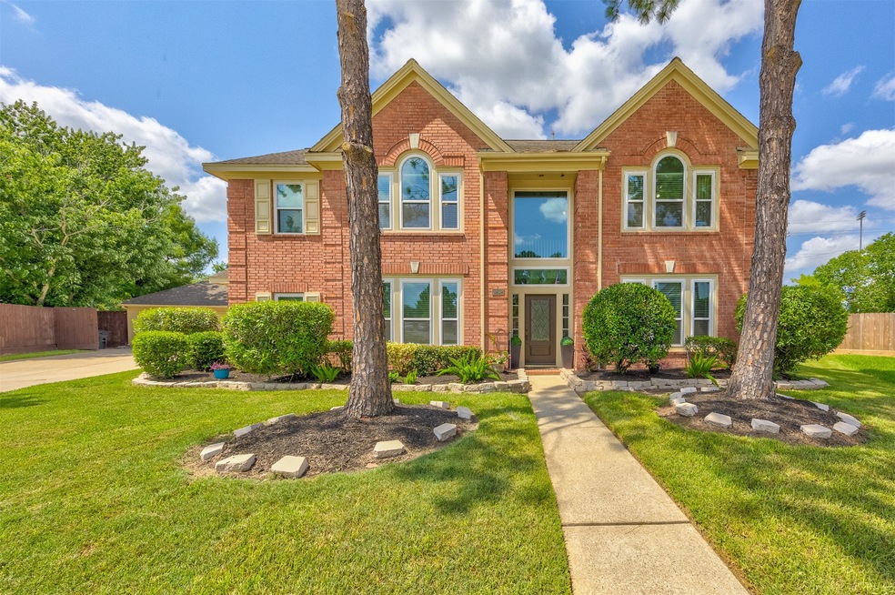 Gorgeous 4 bedroom, 3.5 bath home with formal dining, study with French doors, gameroom up, sparkling pool, enormous cul-de-sac lot in Friendswood ISD