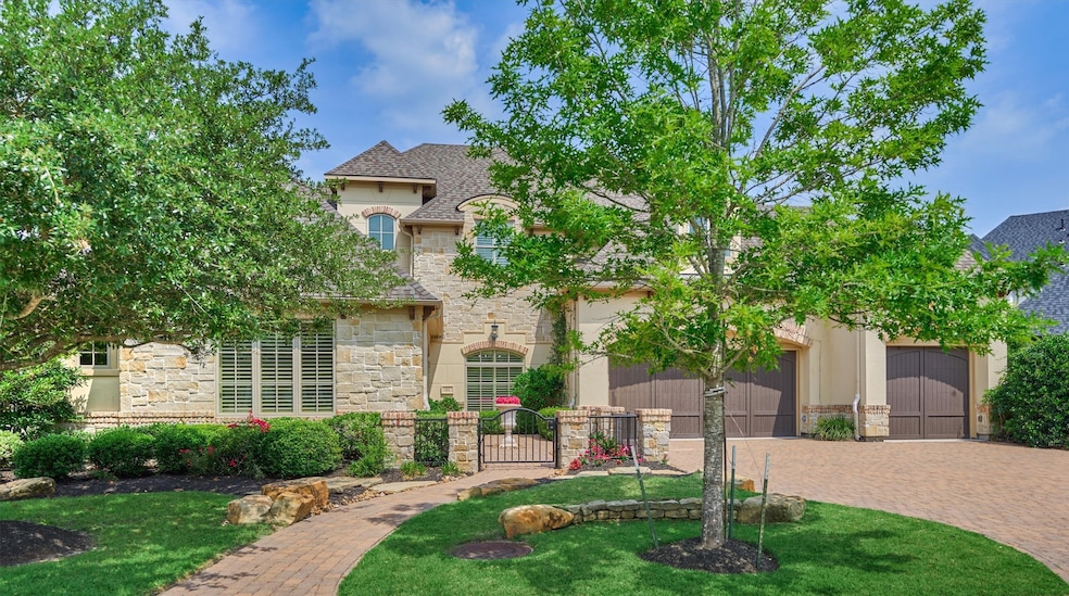 This home features a charming stone and stucco ext