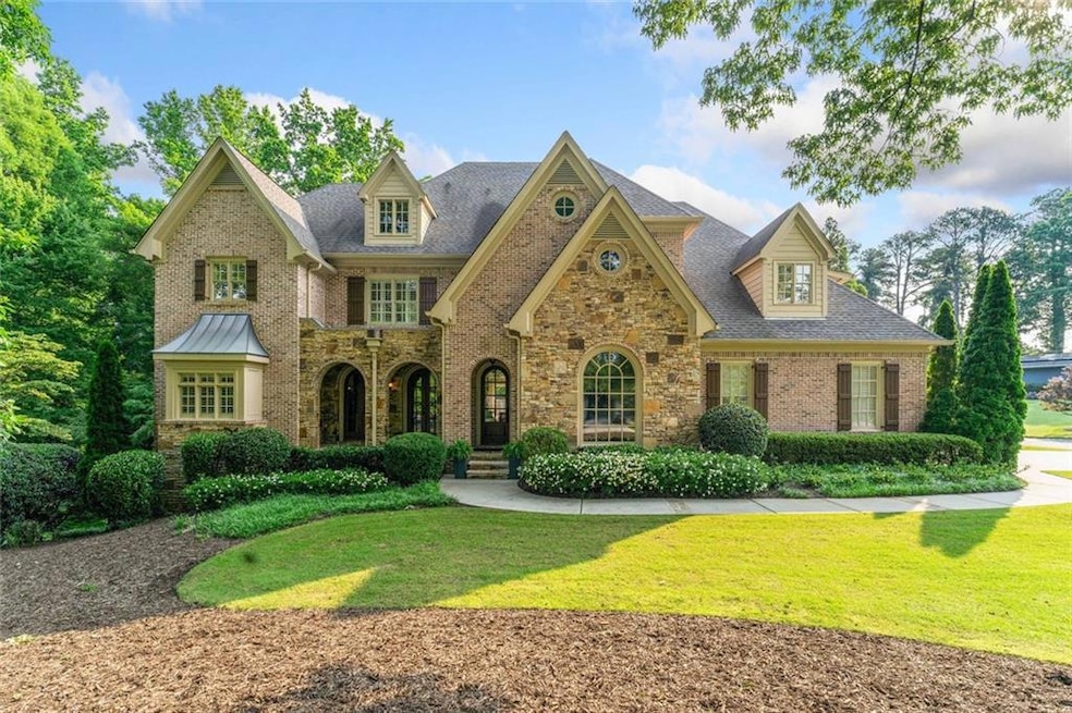 This magnificent 8,092 sq ft all-brick home blends timeless elegance with modern convience