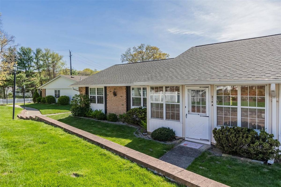 View of front of property featuring brick siding, 