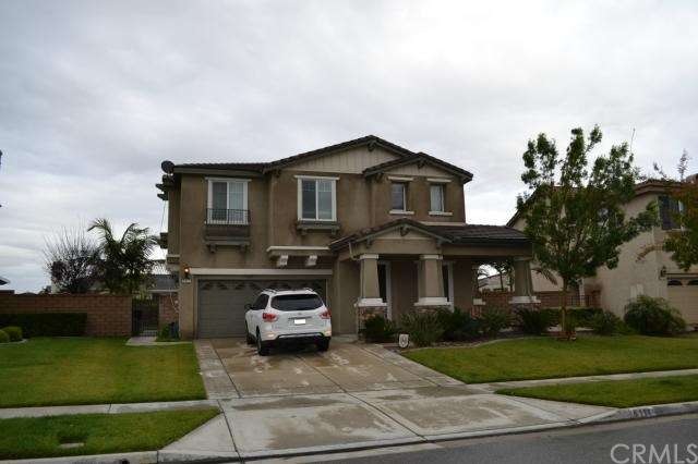 Front of home with large yard and beautiful mounta
