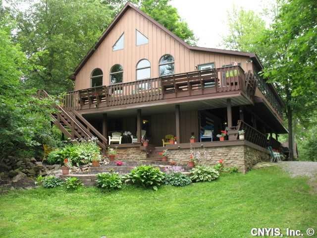 Exterior Front Well built custom riverfront home