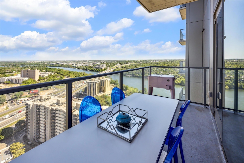 View of Lady Bird Lake and balcony large enough for dining table with 6 chairs and more!
