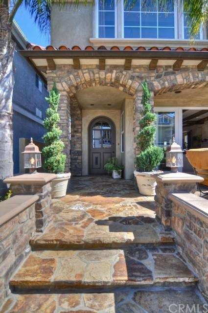 Dramatic stone steps lead to a charming dark wood 