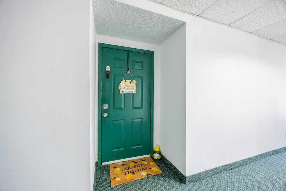 Property entrance with stucco siding