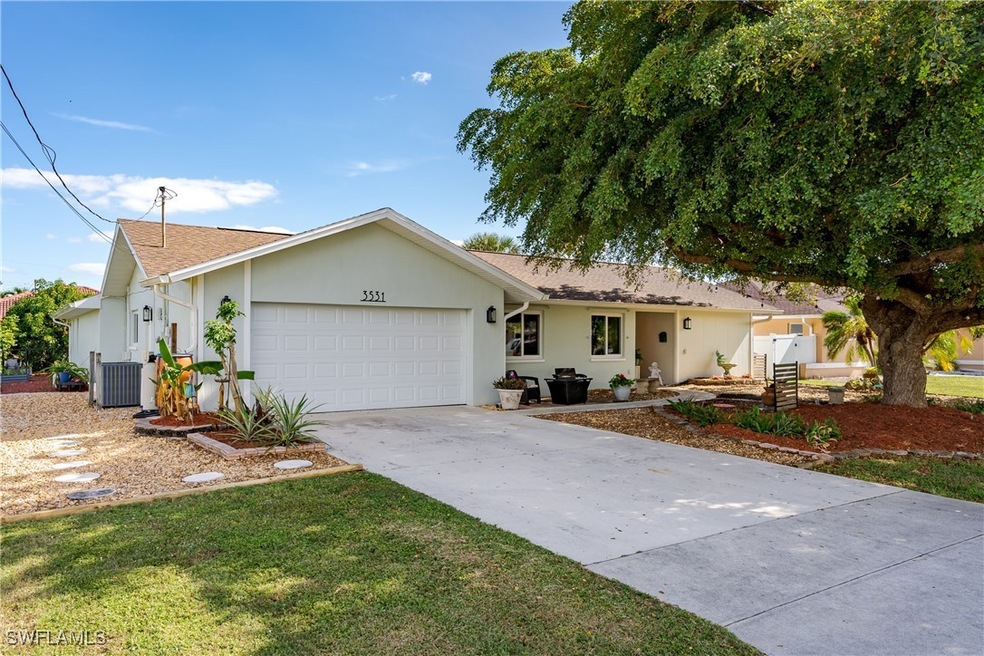 Ranch-style house featuring central AC and a garag