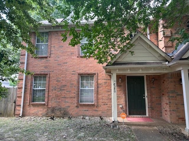 View of front of house featuring brick siding